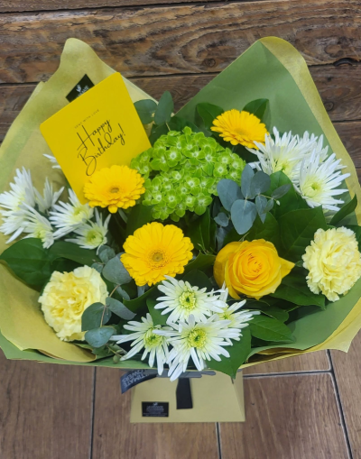 Lemon Grove - A bright and uplifting bouquet in sunny yellows, fresh greens and crisp whites, finished with soft silvery foliage.