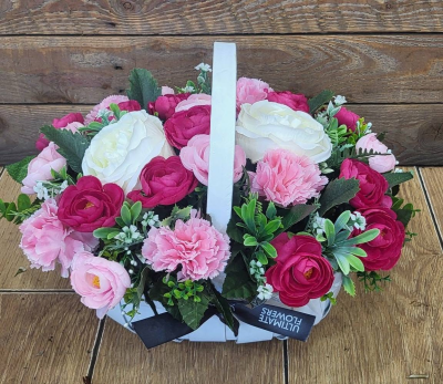 Raspberry Cream - A pretty basket arrangement combining rich raspberry pinks, softer pink tones and creamy whites with fresh green accents.