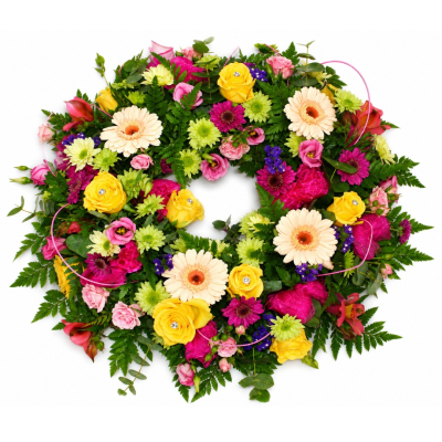 Forever Bright Wreath - A vibrant open wreath bursting with bright pink, yellow, peach and green tones, finished with lush foliage for a colourful and uplifting tribute.